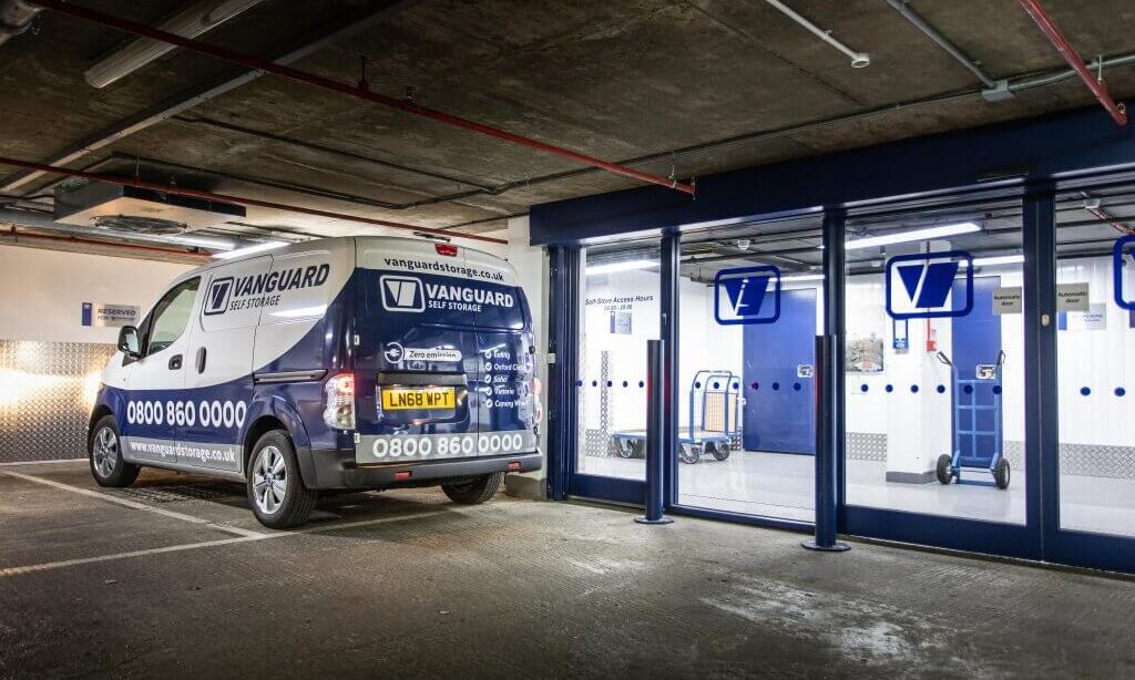 A photo showing the Vanguard van parked outside one of Vanguard's self storage branches.