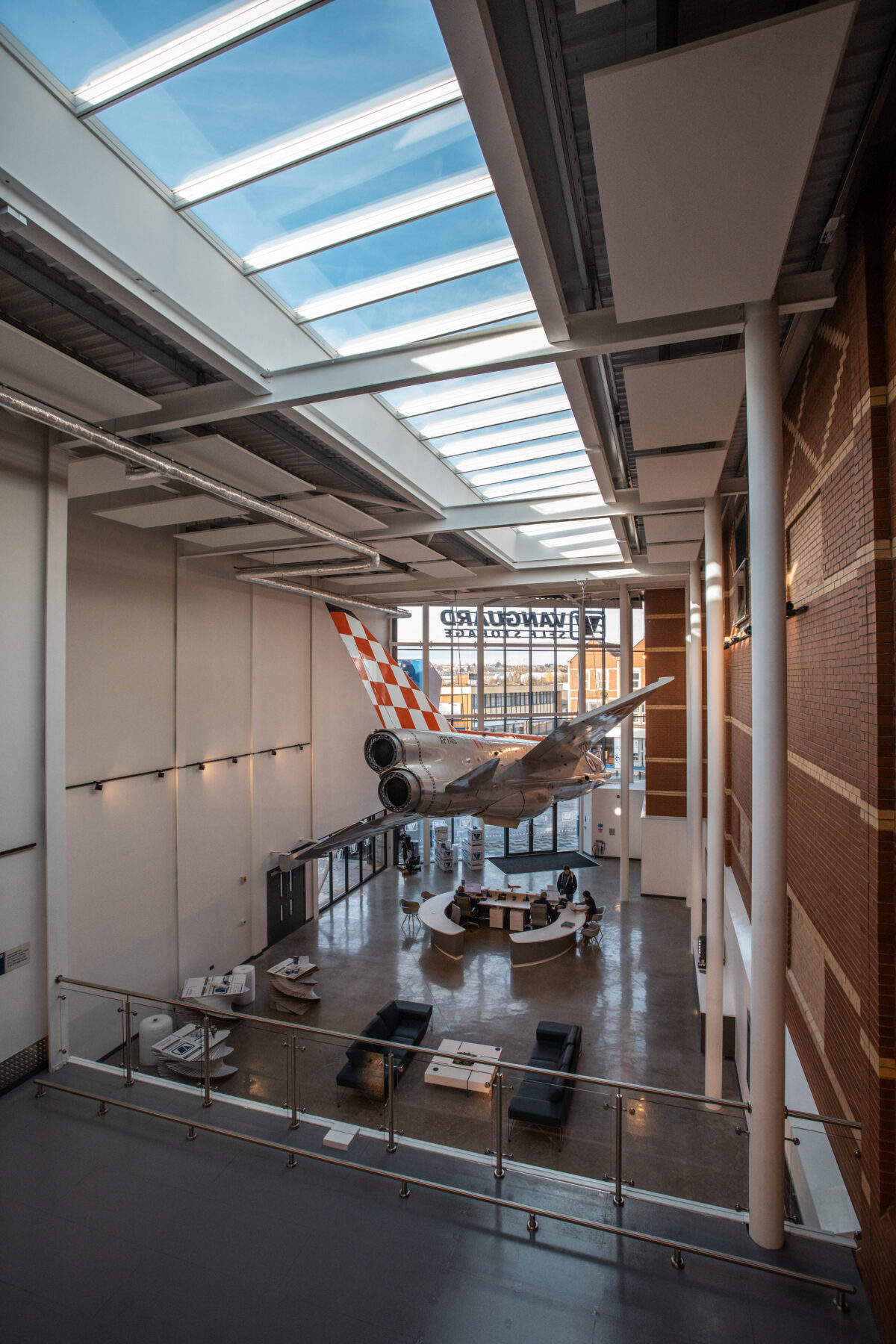 An interior shot of Vanguard Storage in Bristol, showcasing the fully restored English Electric Lightning fighter jet plane hanging in the reception.