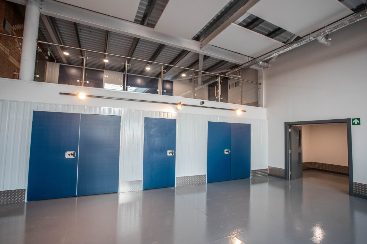 An interior shot of a Vanguard Self Storage branch showing three storage units.
