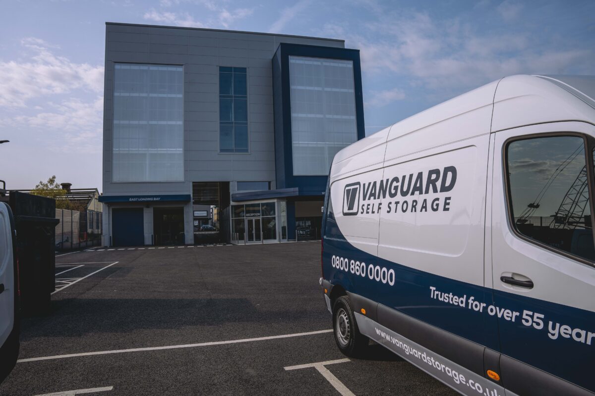 A photo showing the exterior of the Vanguard Self Storage branch in Staples Corner, with the Vanguard van parked on the right.