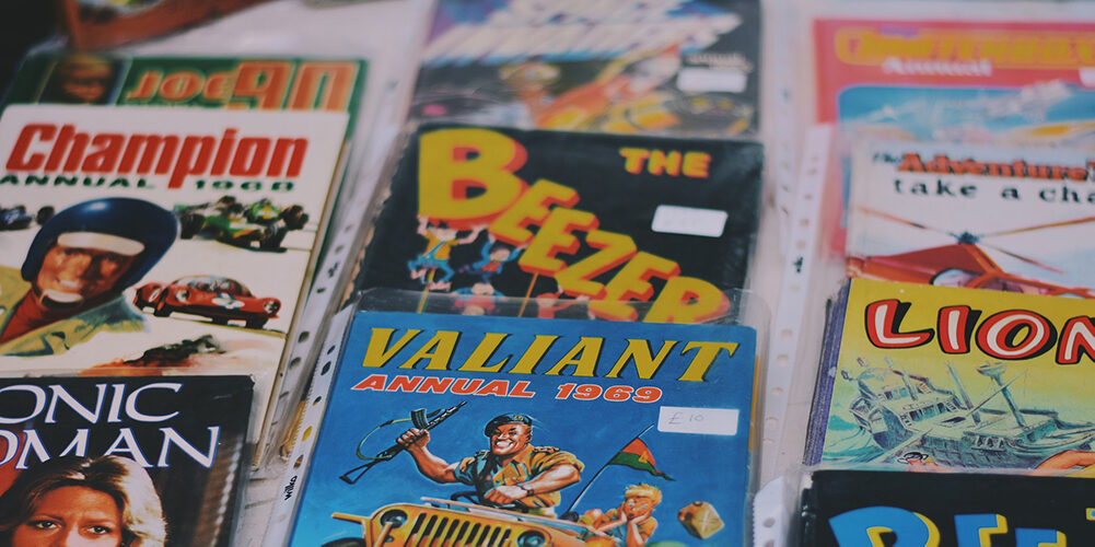 A photo showing a range of collectible magazines and comics spread on a table.