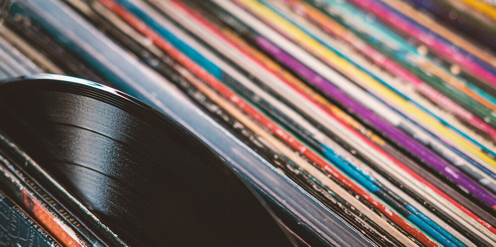 A photo showing a large number of music vinyls.