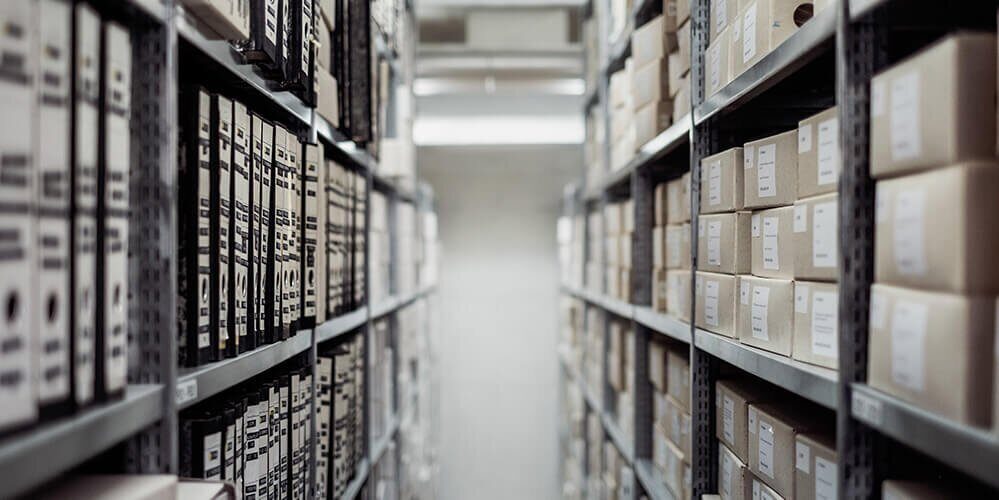 A photo showing many storage boxes and folders inside of an archive.