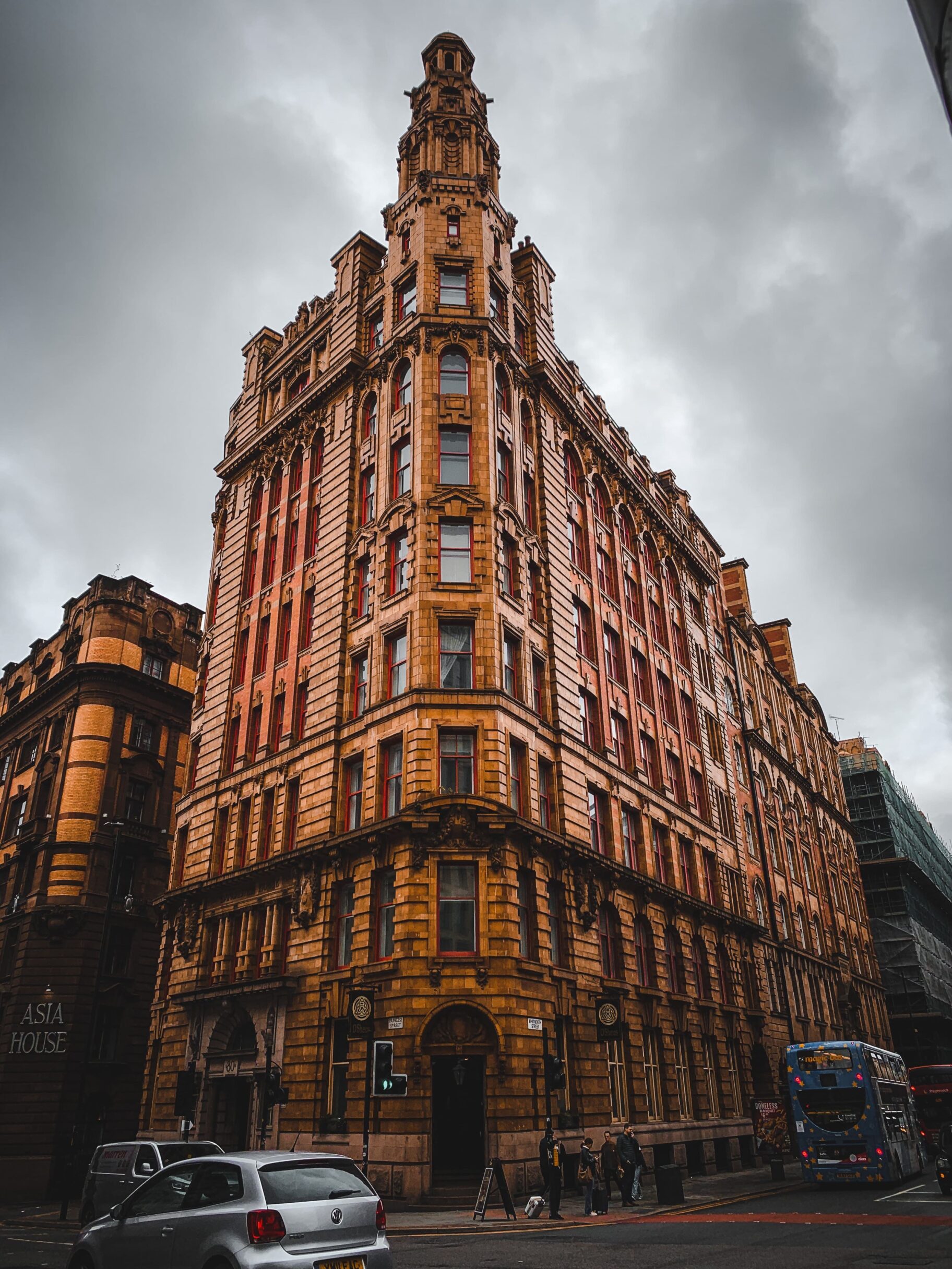 A photo showing the exterior of a building near a busy road.