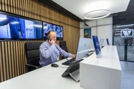 A photo of a Vanguard employee working at the reception in one of our self storage branches.