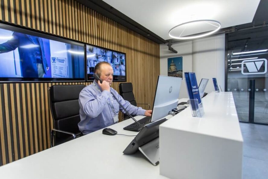 A photo of a Vanguard employee working at the reception in one of our self storage branches.