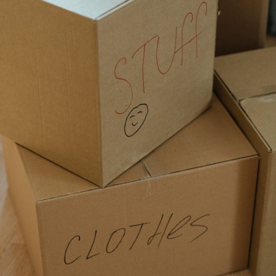 A photo showing cardboard storage boxes labelled for a move.